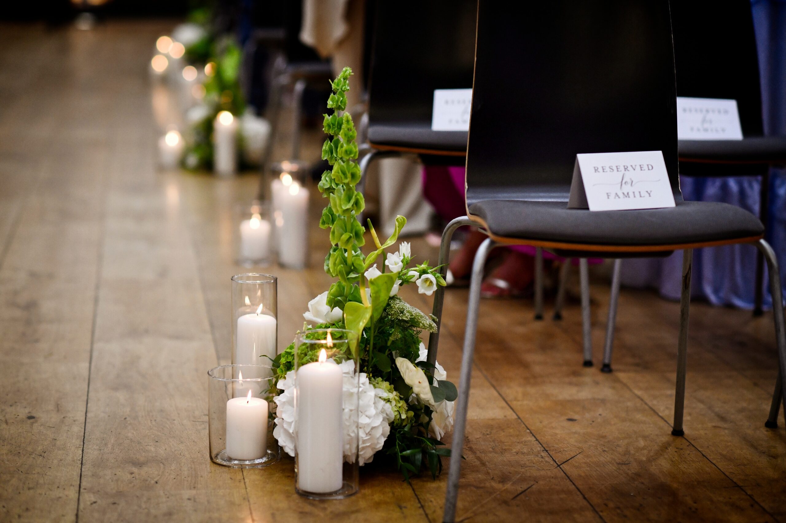 Wedding ceremony aisle flowers by Carol Evelyn Florist