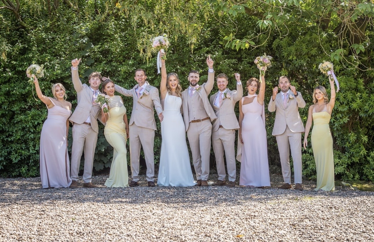 Wedding party with flowers by Carol Evelyn Florist in Saddleworth