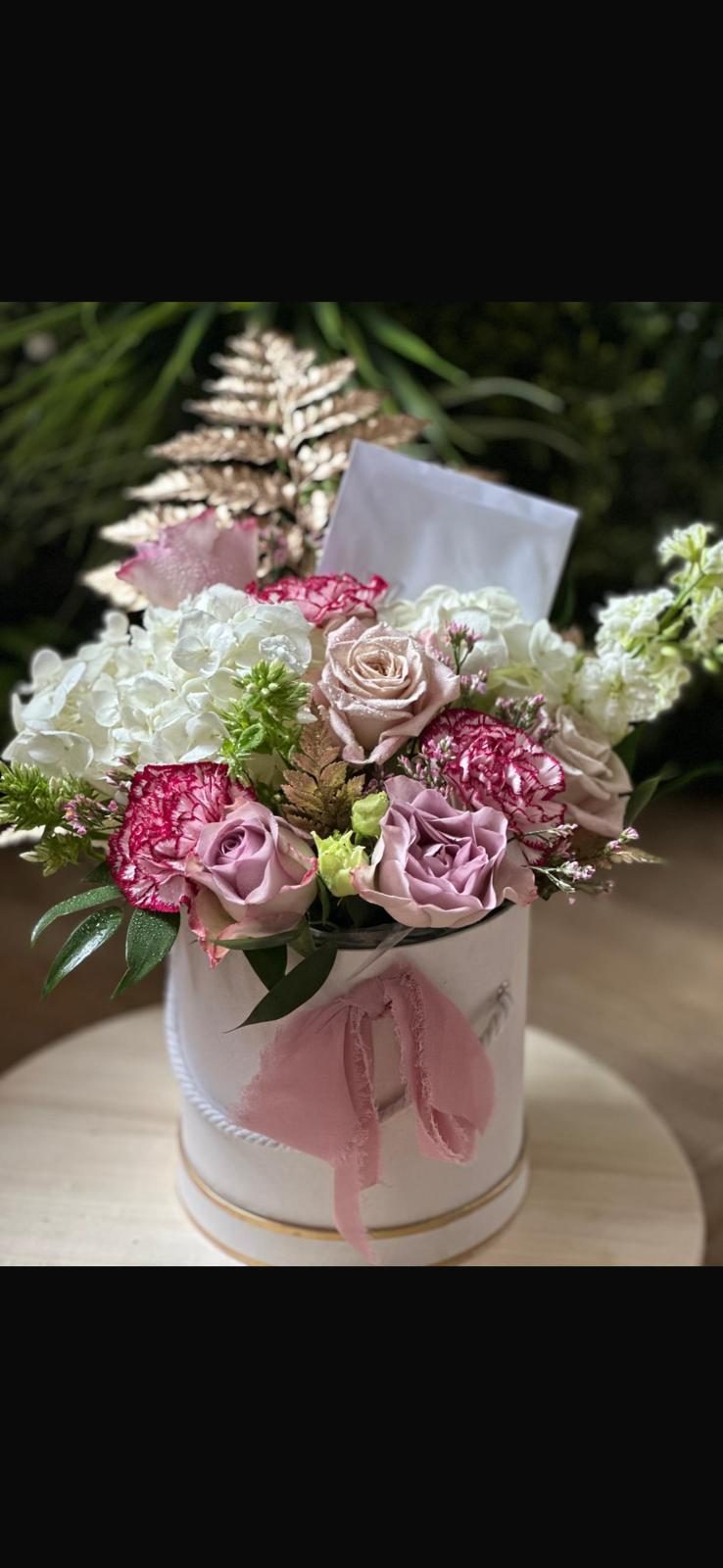 Pink and white flower arrangement by Carol Evelyn Florist